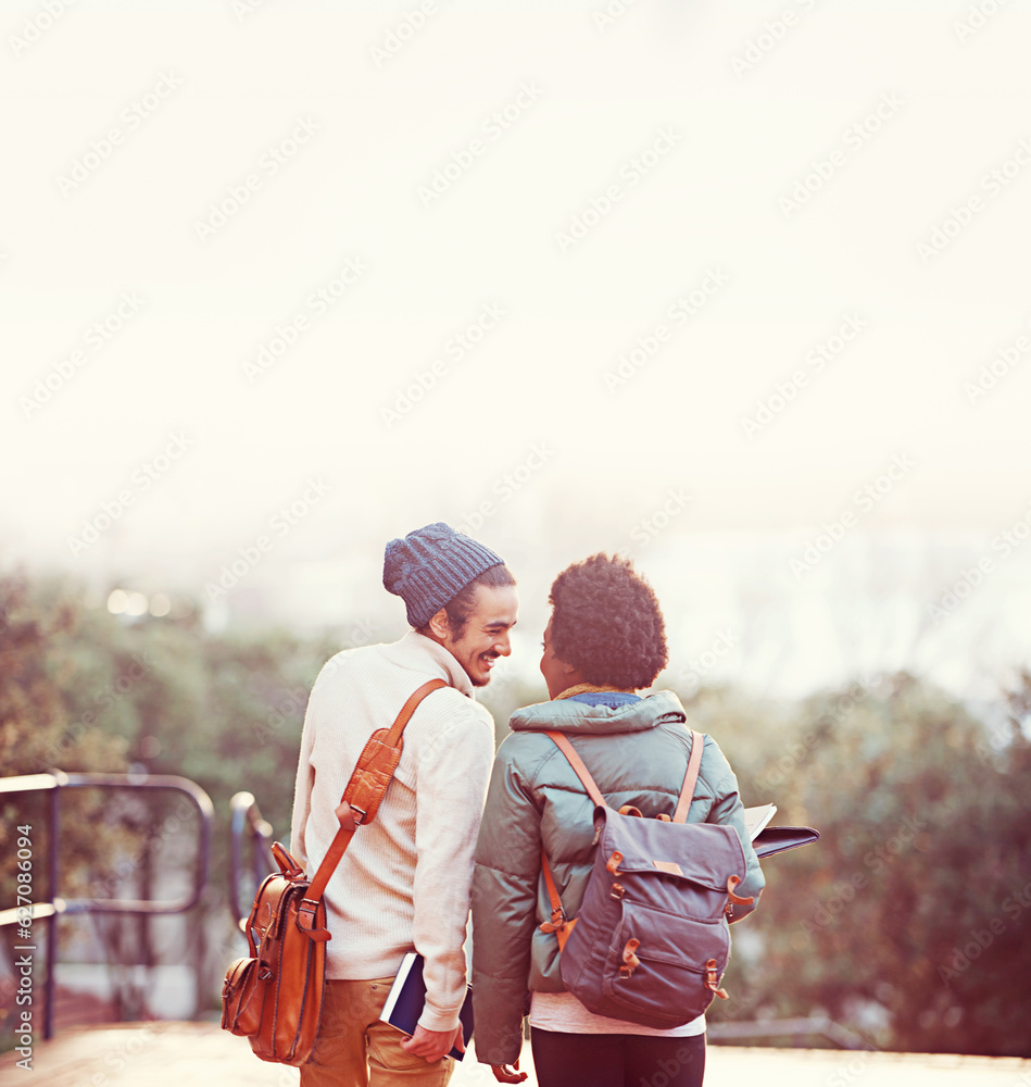 Young love. Rearview shot of an affectionate young couple on campus.