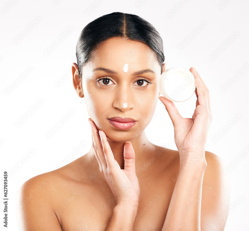 Woman, portrait and cream for skincare, beauty or cosmetics against a white studio background. Face 