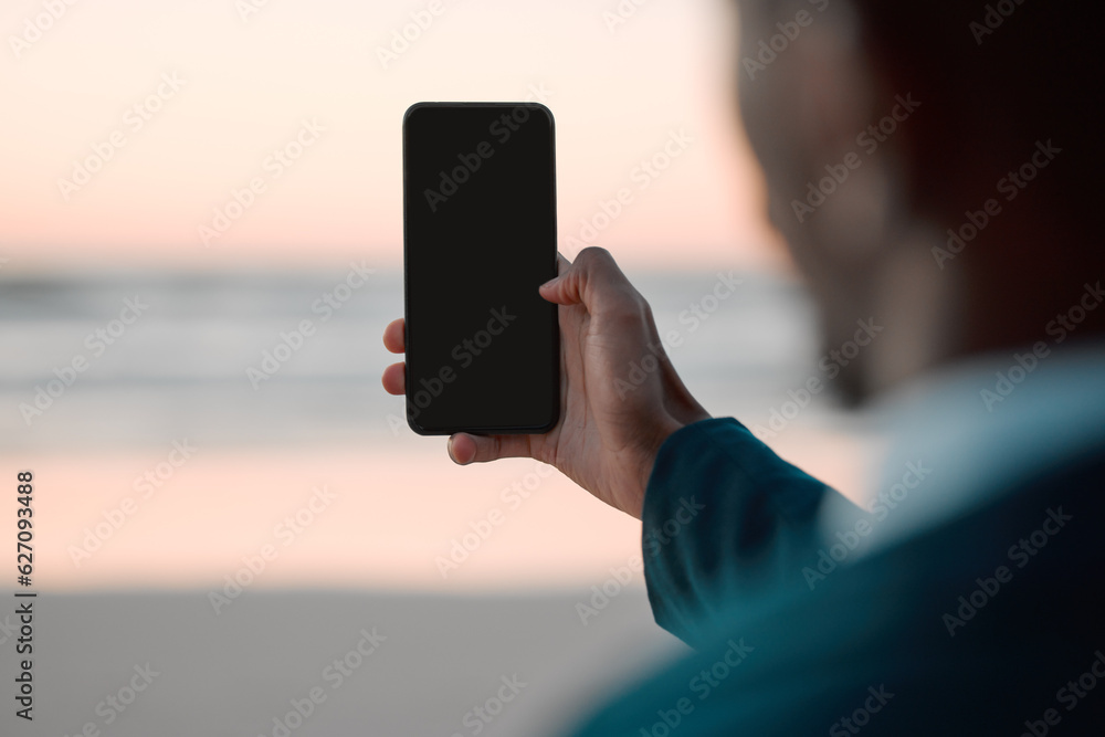 Businessman, hands and phone screen on beach for communication, advertising or outdoor networking. C