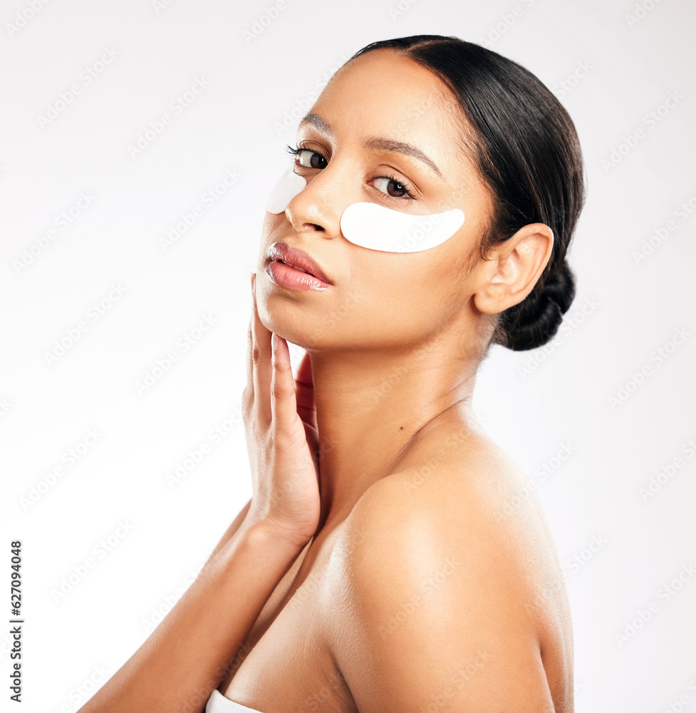 Woman, portrait and eye pads for skincare, beauty or cosmetics against a white studio background. Fa