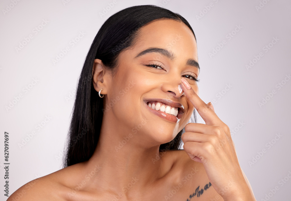 Happy woman, portrait smile and cream on nose for skincare cosmetics against a grey studio backgroun