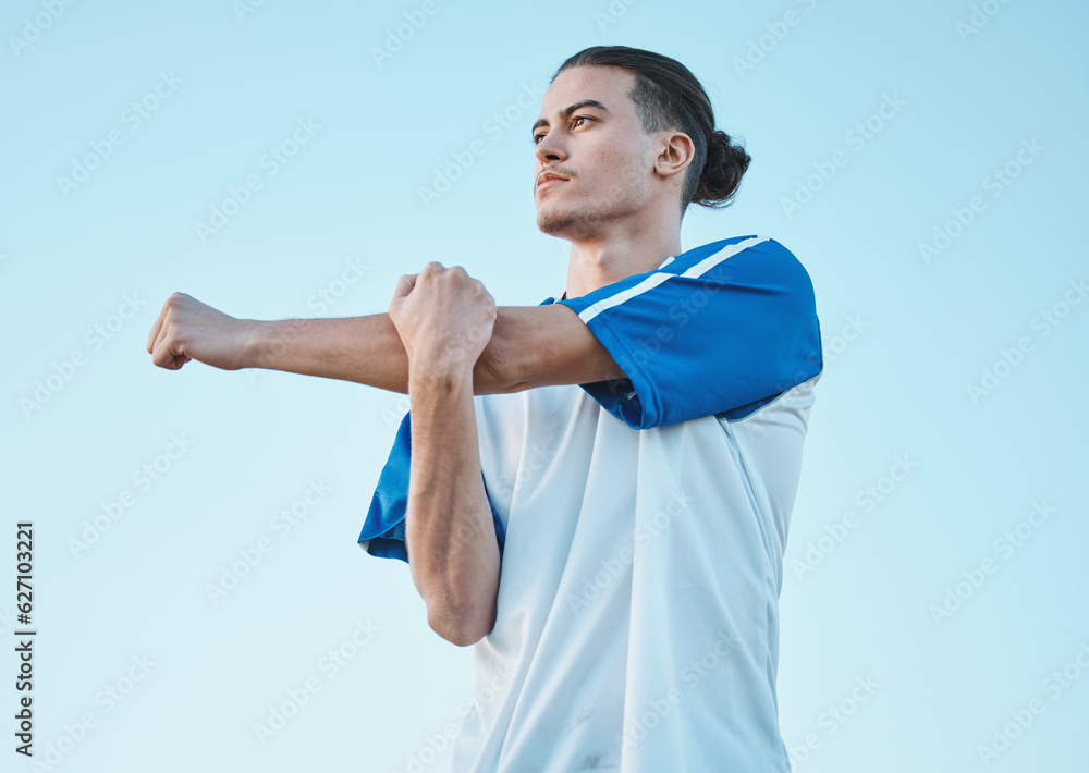 Soccer, fitness and stretching with a man on a blue sky background in preparation of a game or compe