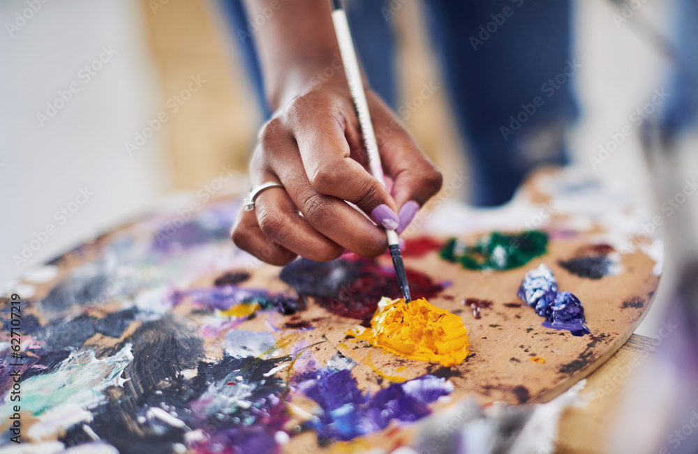 Let the colors inspire you. Cropped shot of an unrecognizable woman holding a painters palette.