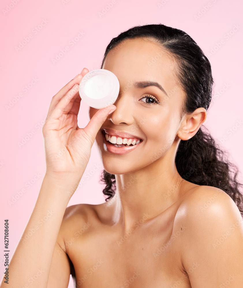 Face, skincare and woman smile with cream container in studio isolated on a pink background. Portrai