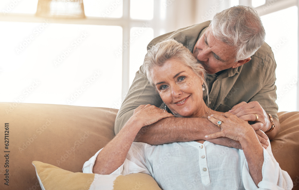 Senior, portrait and a couple kiss and hug on the living room sofa for love, care and bonding. Happy