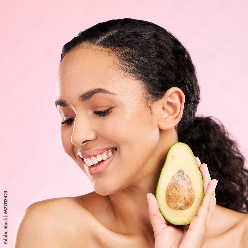 Smile, skincare and woman with avocado in studio isolated on a pink background. Happy, natural cosme