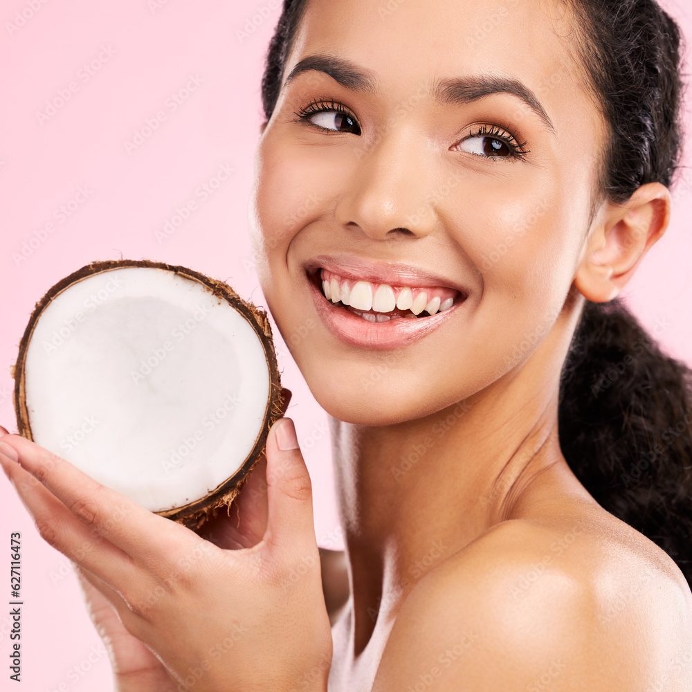 Coconut, fruit and woman thinking of skincare, beauty or vegan cream on a pink, studio background. Y