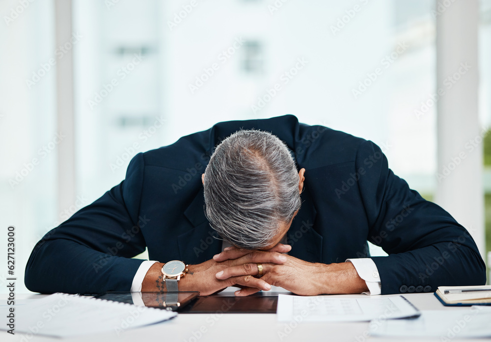 Burnout, professional and senior man sleeping at desk with tech or problem with fatigue in office. T