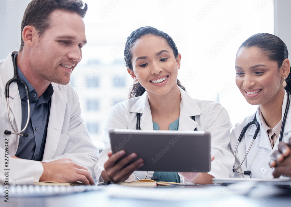 Medical, tablet and collaboration with a team of doctors in the hospital boardroom for a meeting. Te