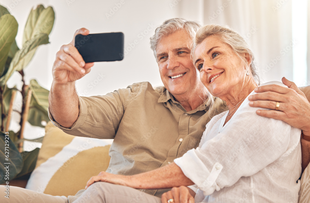 Happy senior couple, hug and selfie in relax on living room sofa for photograph, memory or vlog at h