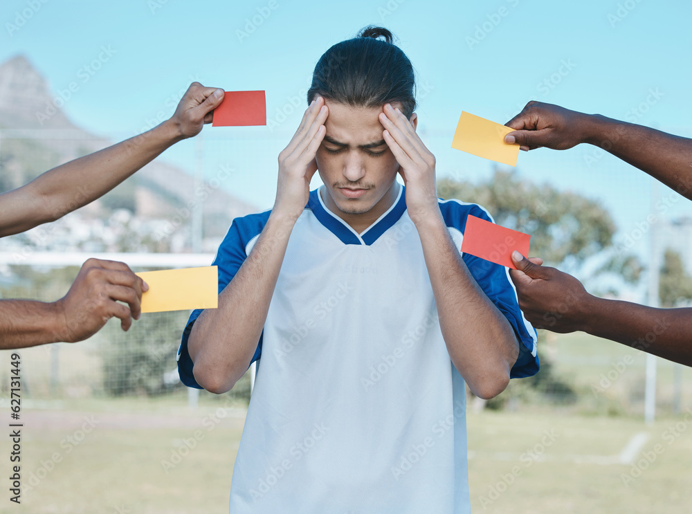 Hands, card and man with stress from soccer, training headache and warning on the field. Sports, bur