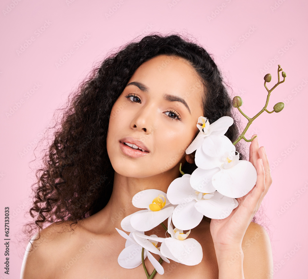 Face, orchid and skincare of woman for beauty in studio isolated on a pink background. Portrait, flo