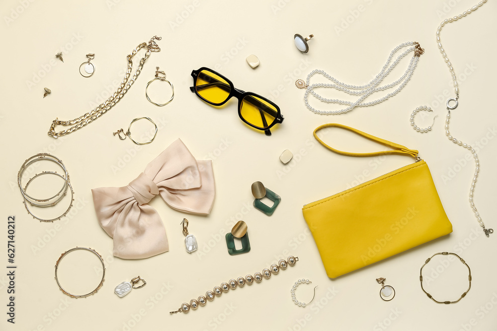 Stylish accessories with sunglasses and bag on light background