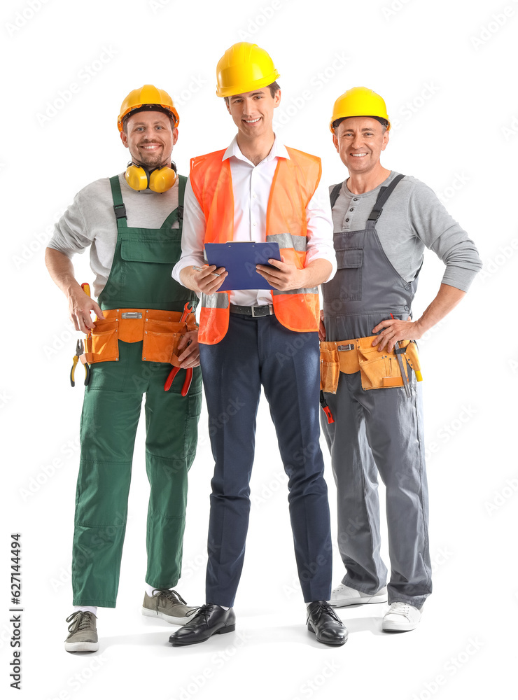 Team of male builders with tools on white background