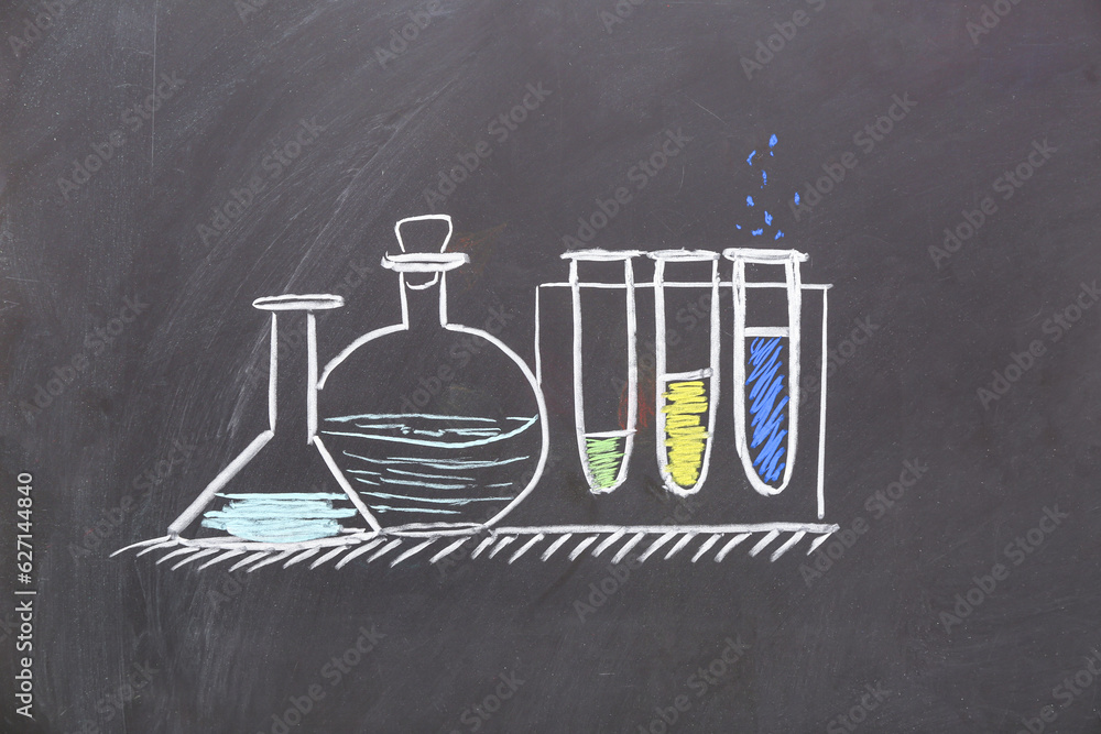 Drawn laboratory glassware on black chalkboard