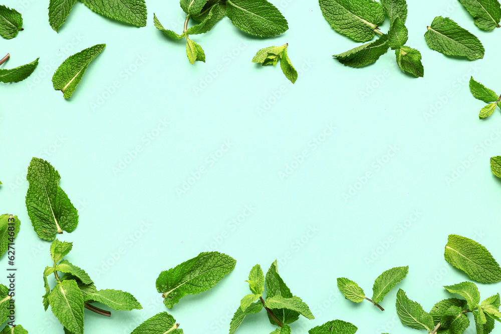 Frame made of fresh mint leaves on color background