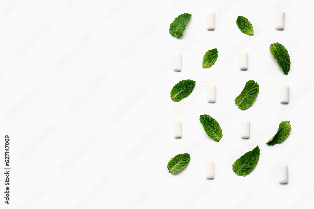 Fresh chewing gums with mint on white background