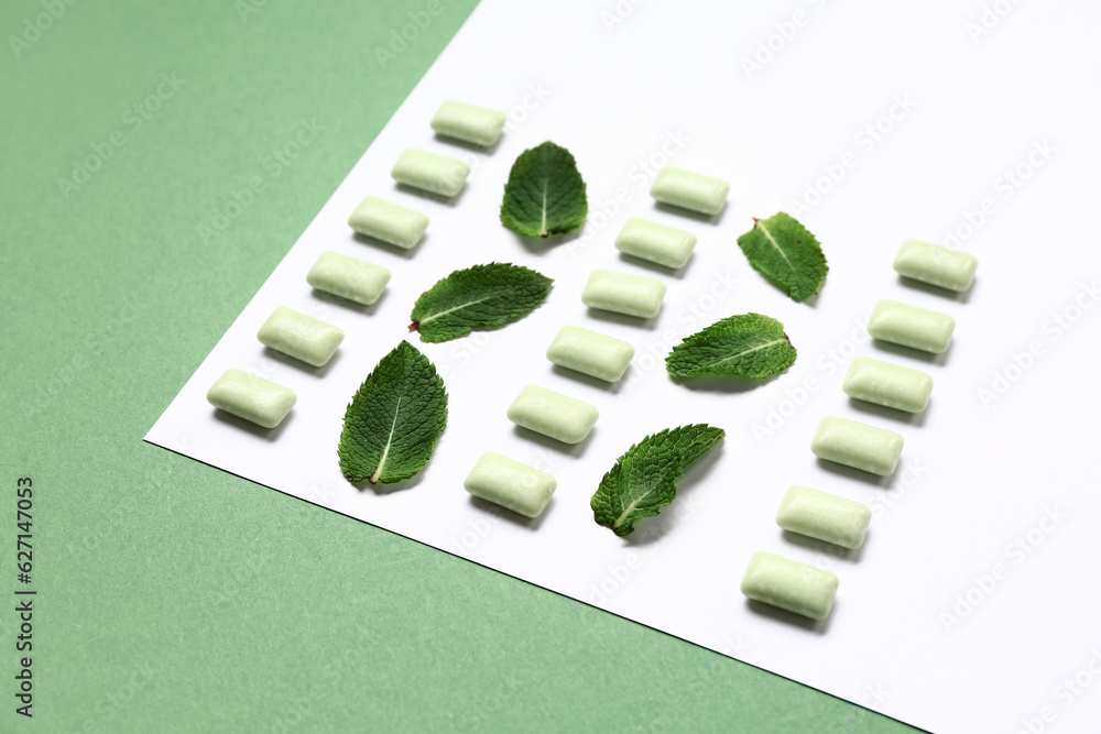 Fresh chewing gums with mint on colorful background