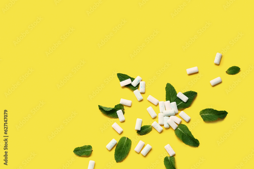 Fresh chewing gums with mint on yellow background