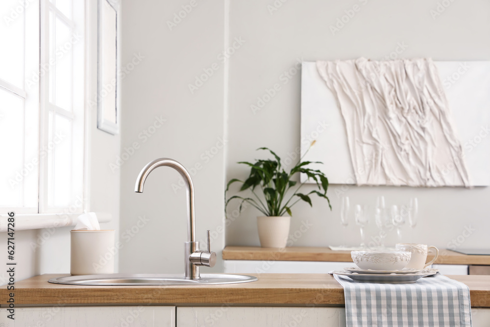 Kitchen counter with sink and clean dishes