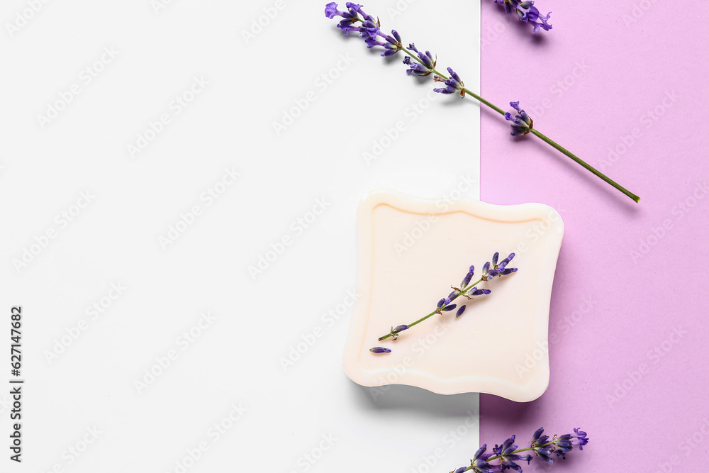 Composition with soap bar and lavender flowers on color background