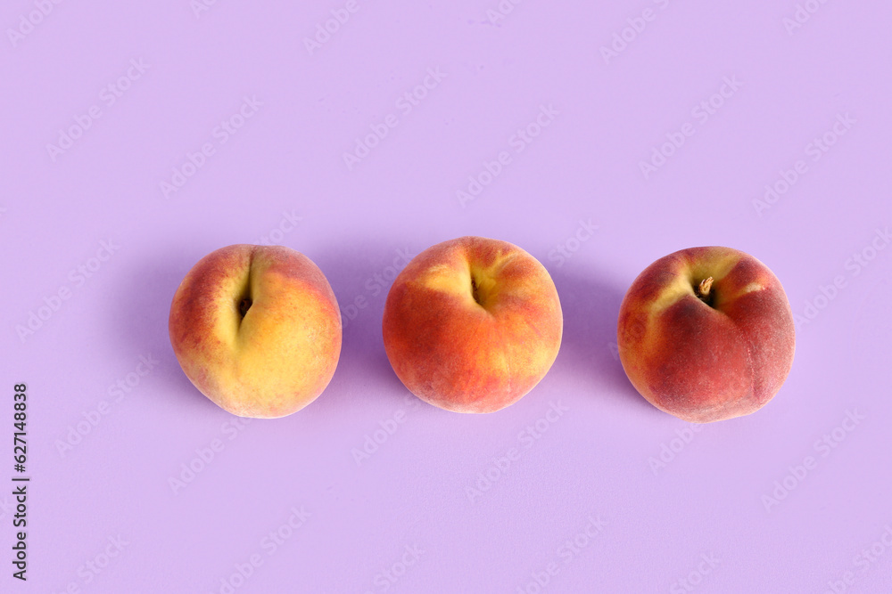 Sweet peaches on lilac background