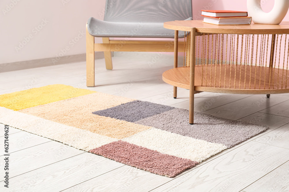 Stylish rug in interior of living room