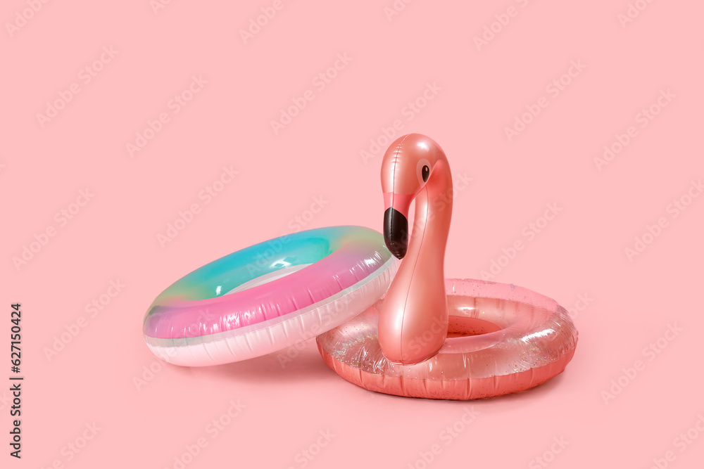 Inflatable rings on pink background