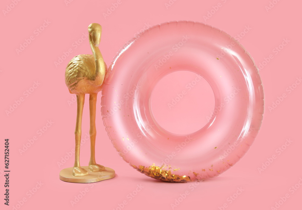 Swim ring with flamingo figure on pink background