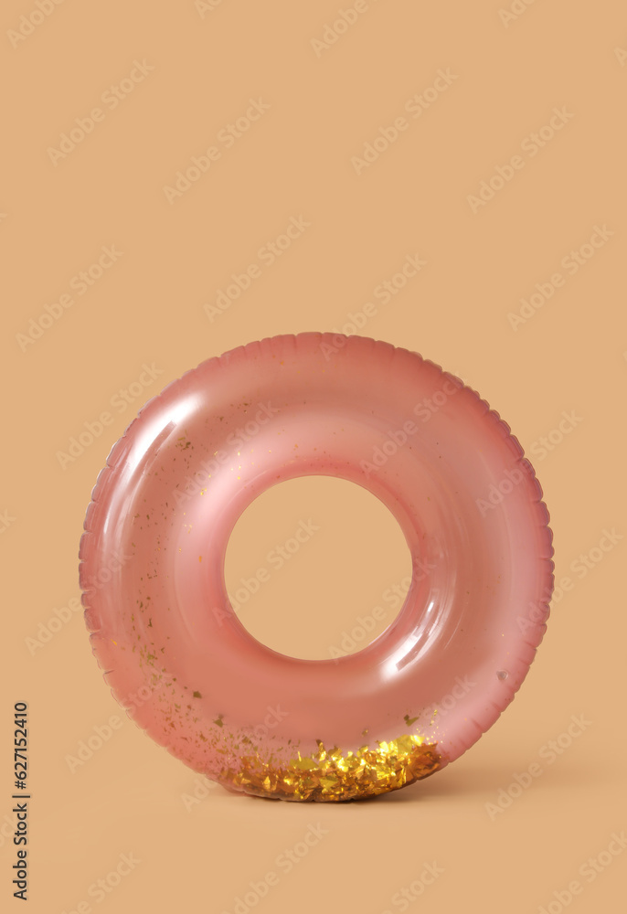 Swim ring on beige background