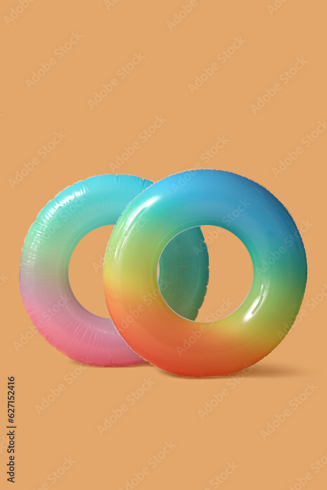 Swim rings on beige background