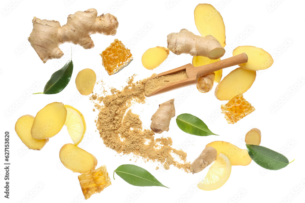 Flying slices of fresh ginger root and wooden scoop with dried powder on white background