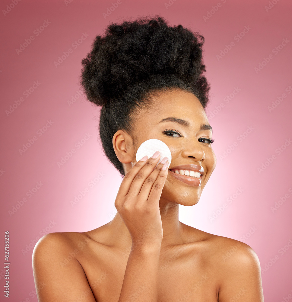 Black woman, cotton pad and skincare with makeup, portrait and facial on a studio background. Female