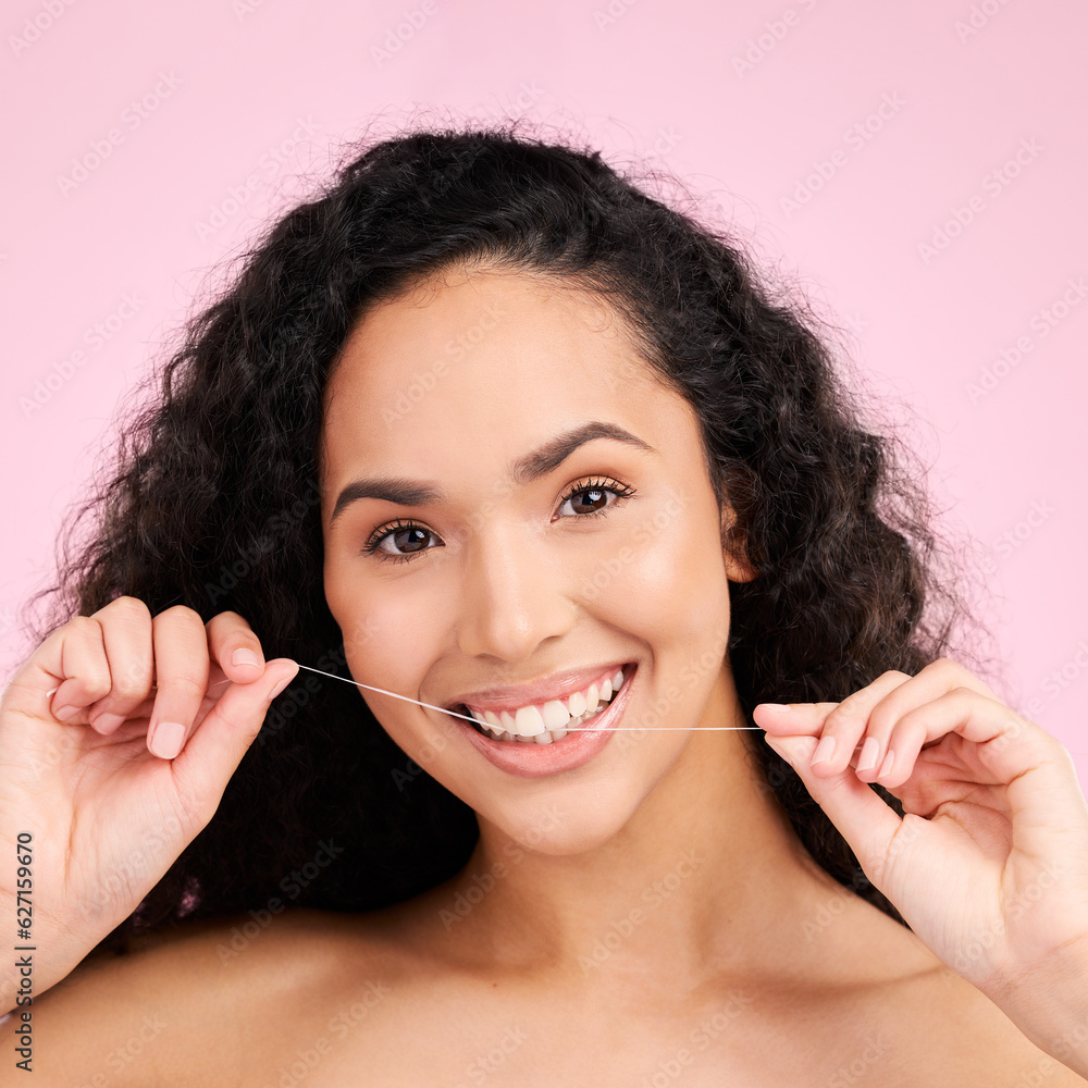 Woman, dental flossing and studio portrait with smile, cleaning and self care for beauty by pink bac