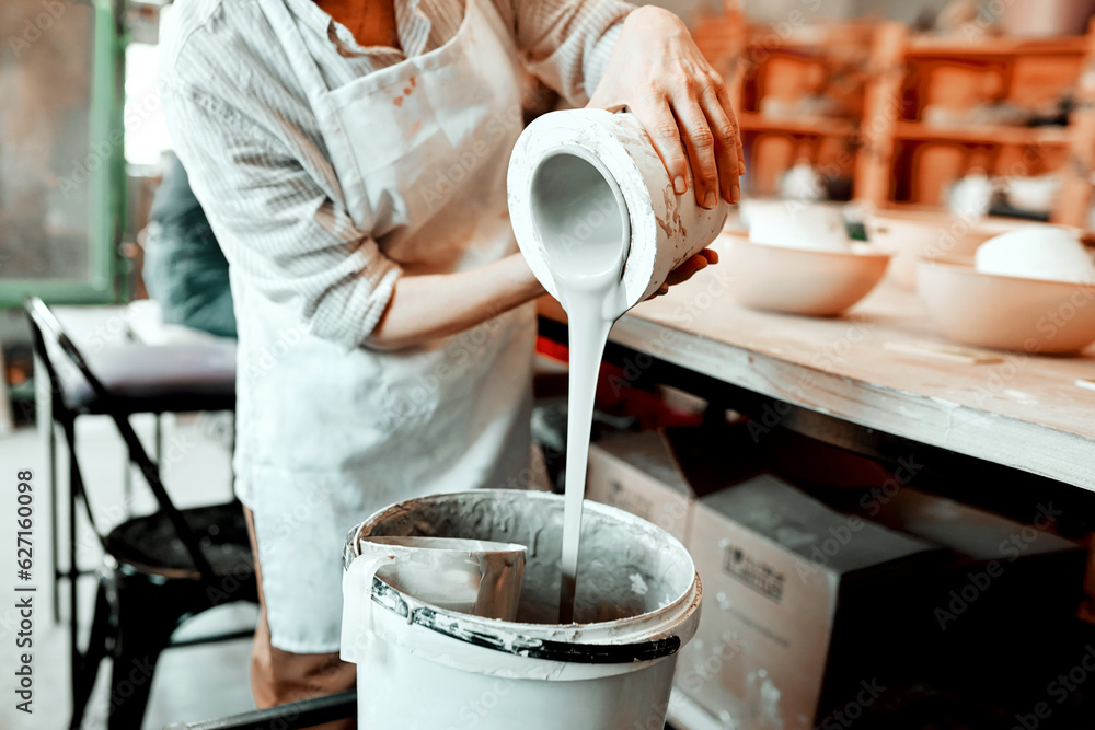 I work with all kinds of clay. Cropped shot of an unrecognizable artisan working in a pottery worksh