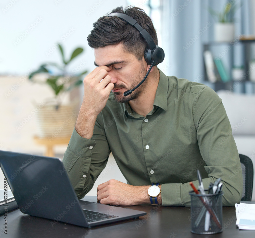 Man, laptop and headache in call center, stress or debt in customer service or support at the office