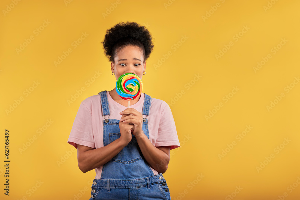 Black woman, portrait with candy or lollipop in studio on yellow background and eating sweets, desse