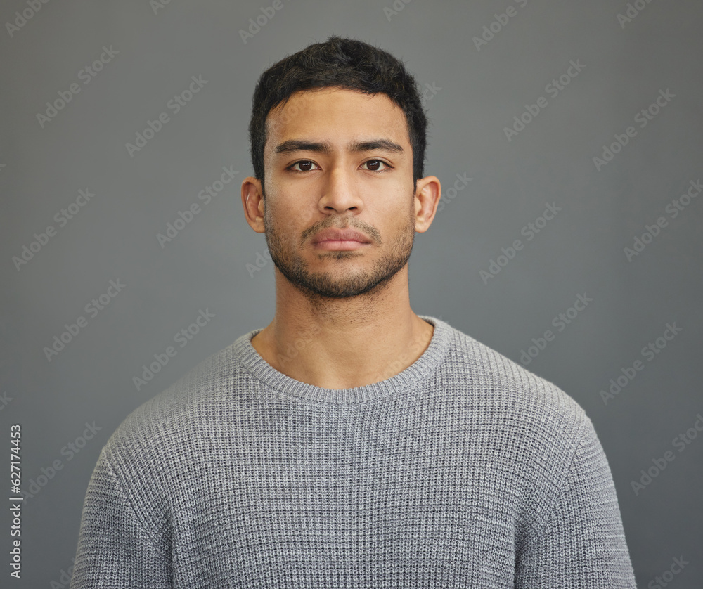 Serious man, casual style and portrait with modern fashion in a studio. Male model, grey background 