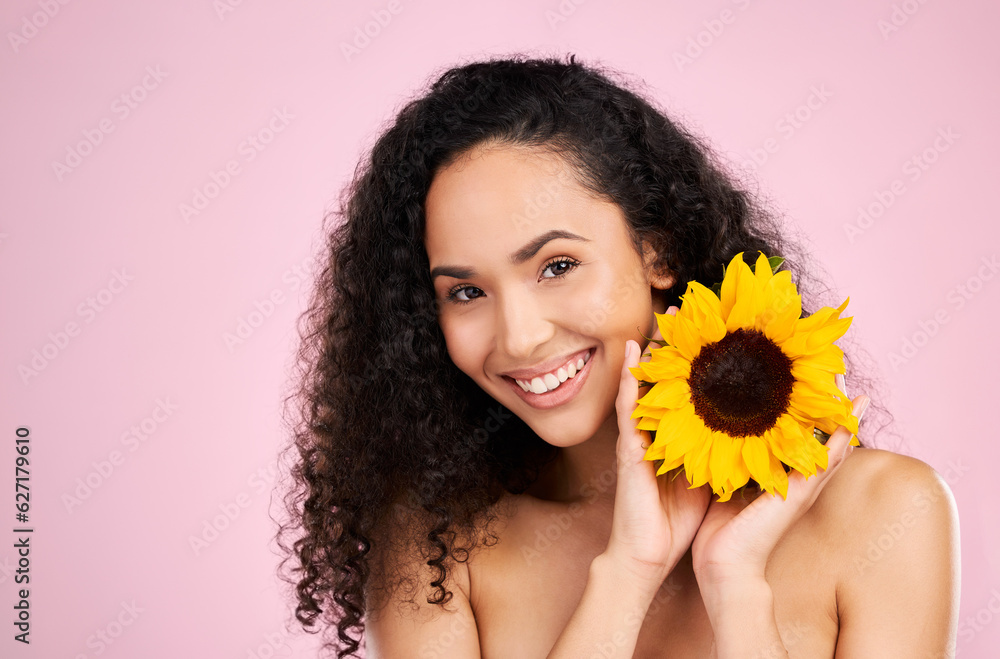 Face, skincare and beauty of woman with sunflower in studio isolated on a pink background mockup. Po