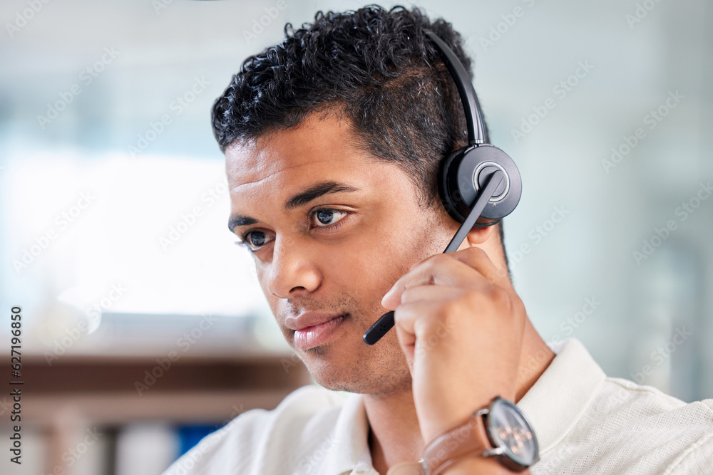 Focus, serious and male call center consultant working on online consultation in the office. Confide