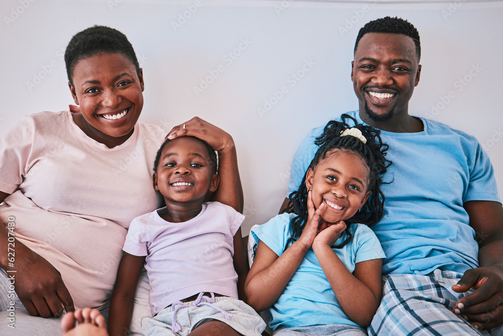 Black family, happy and portrait in a bed with smile, care and comfort on the weekend in their home.