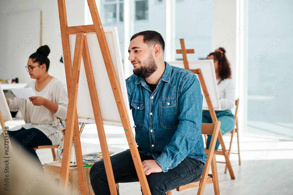 Art is a form of expression. Cropped shot of a diverse group of artists sitting together and paintin