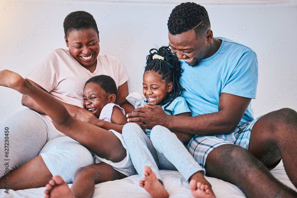 Laugh, black family and tickle in a bed with smile, care and happy on the weekend in their home. Peo