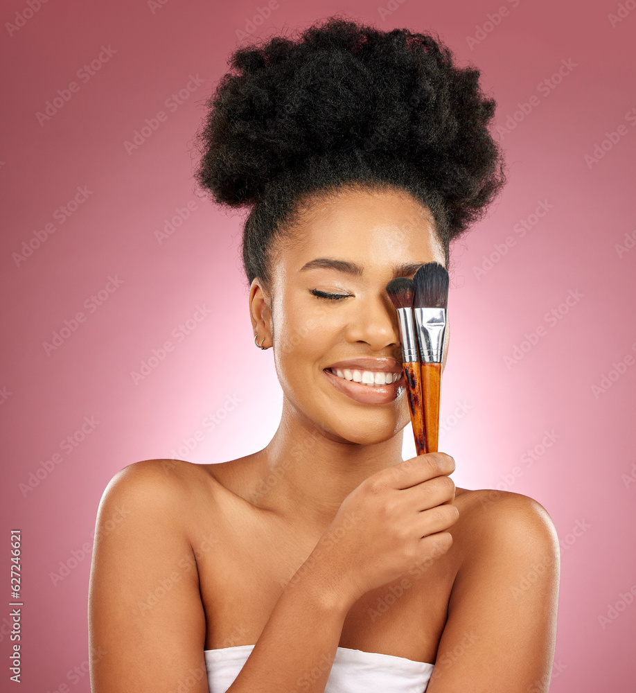 Makeup, smile and black woman with brushes, facial and dermatology against a studio background. Fema