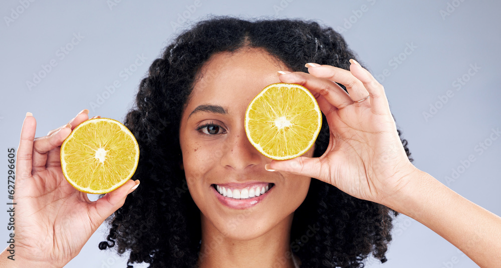 Portrait, skincare and woman with lemon eye for wellness or nutrition in grey studio background. Hap