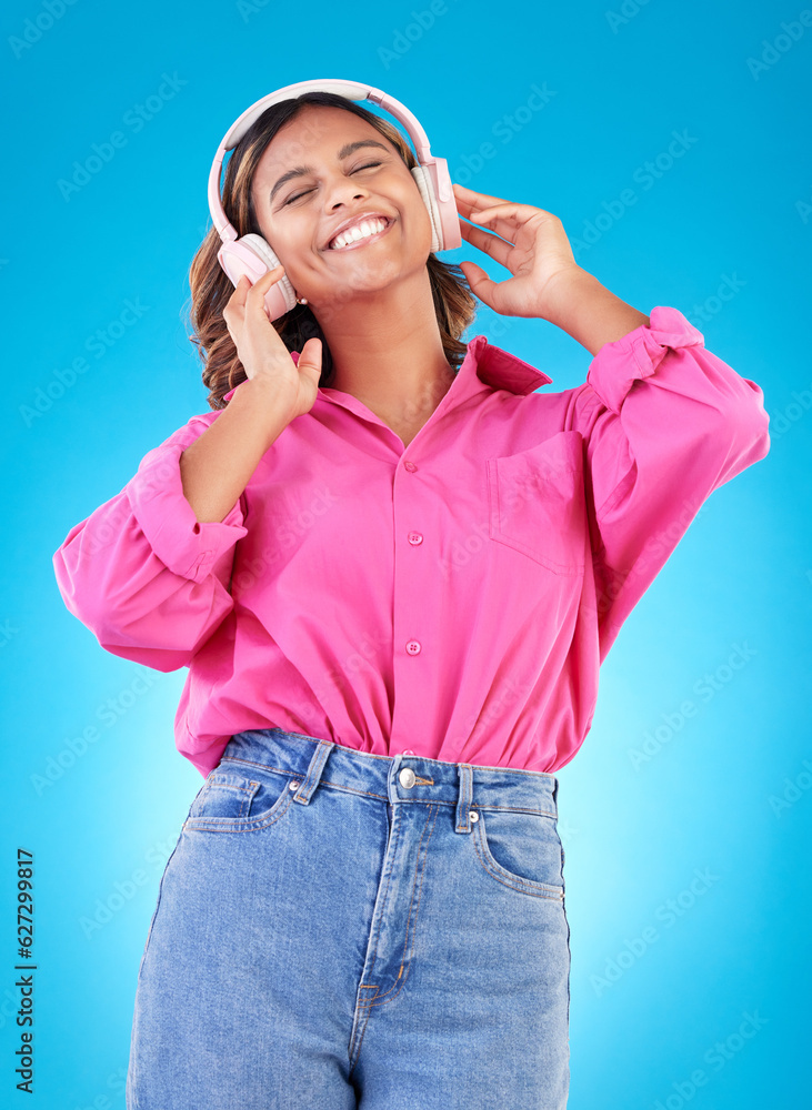 Young woman, headphones and music, audio streaming service and techno or student podcast in studio. 