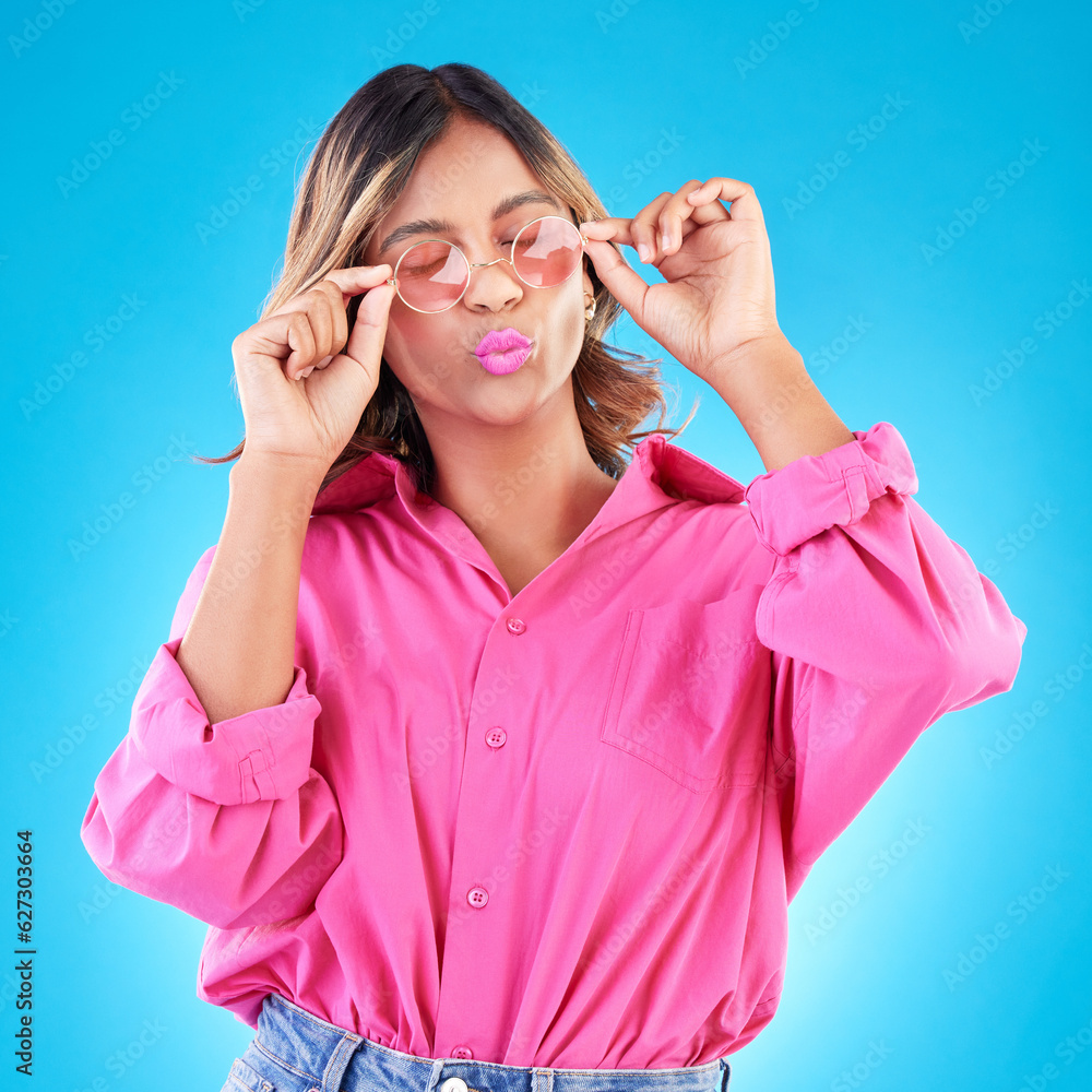 Fashion sunglasses, makeup and woman in studio isolated on a blue background. Cosmetics, glasses and