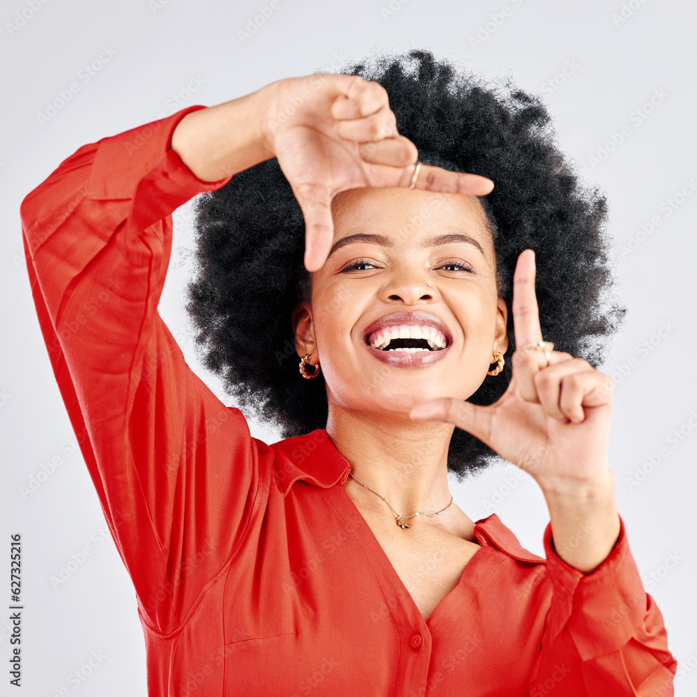 Portrait, happy black woman and finger frame in studio to review profile picture on white background