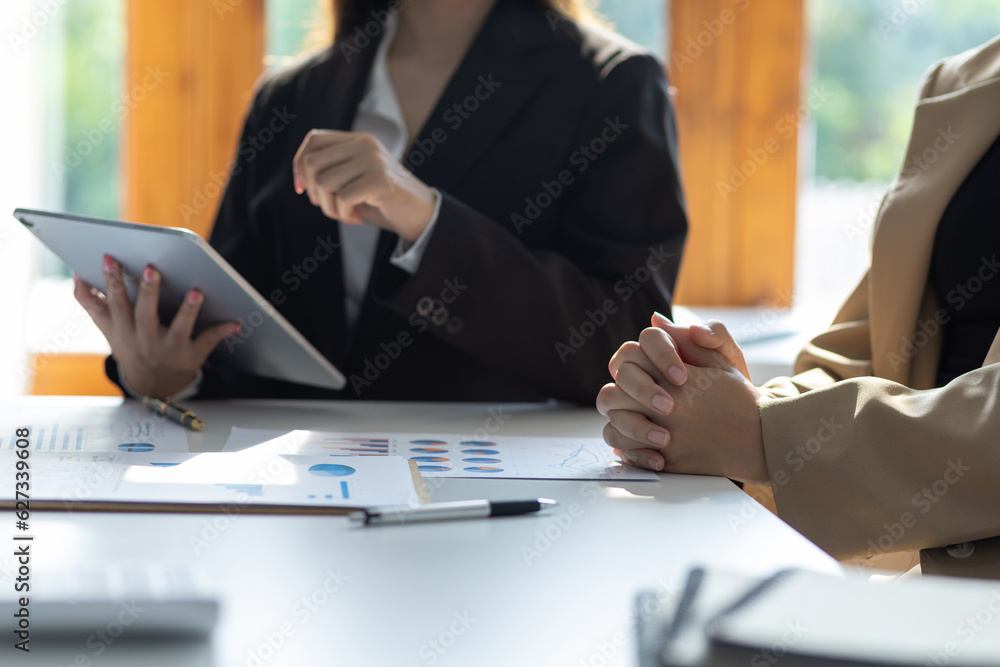 Businesswoman discussing with colleagues at work about work and presenting ideas for starting a new 