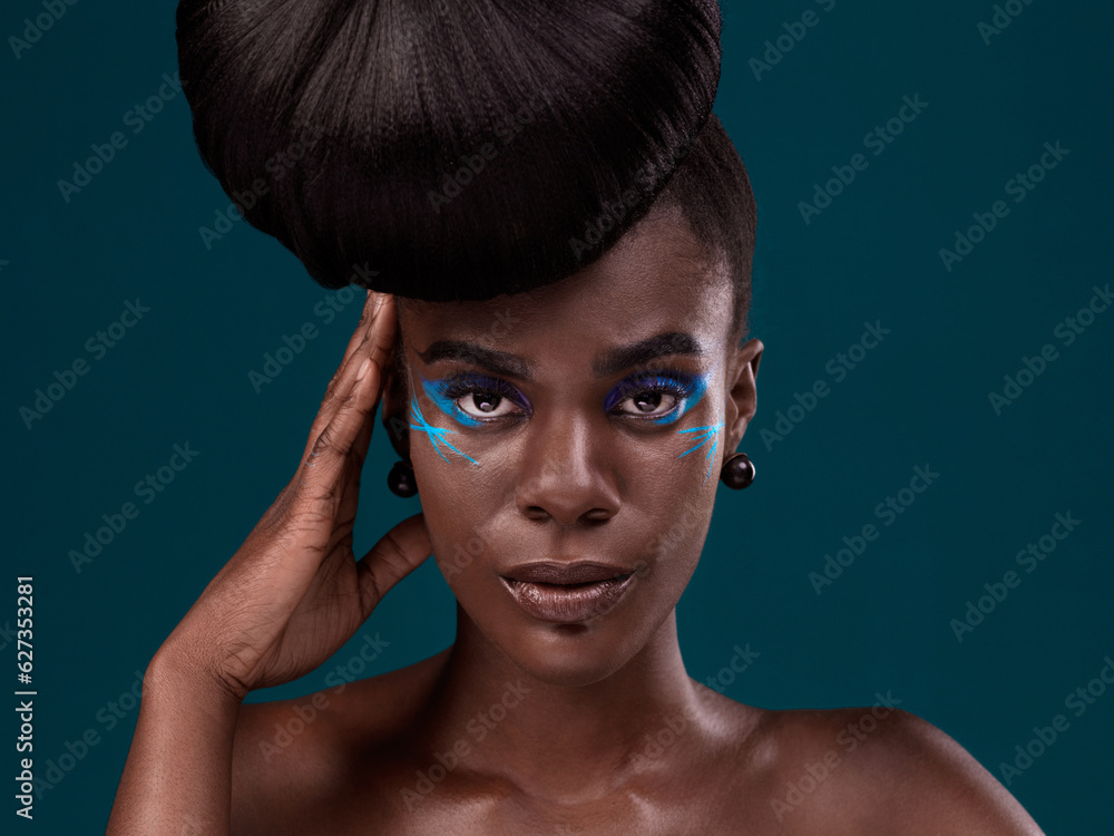 Portrait, hair and makeup with a model black woman in studio on a blue background for beauty. Face, 